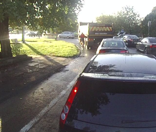 A cyclist using the mandatory cycle lane.